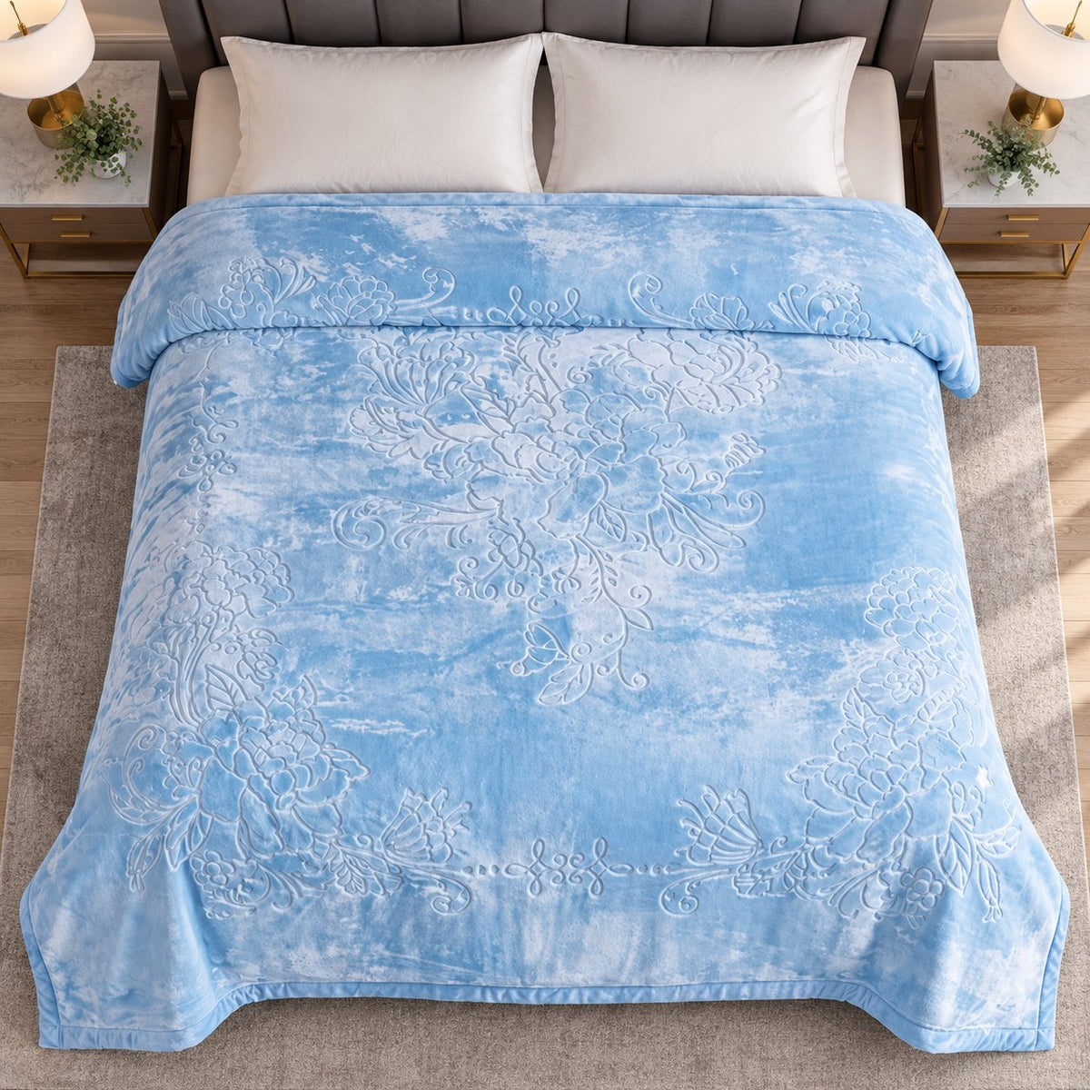 Blue embossed floral king blanket on bed