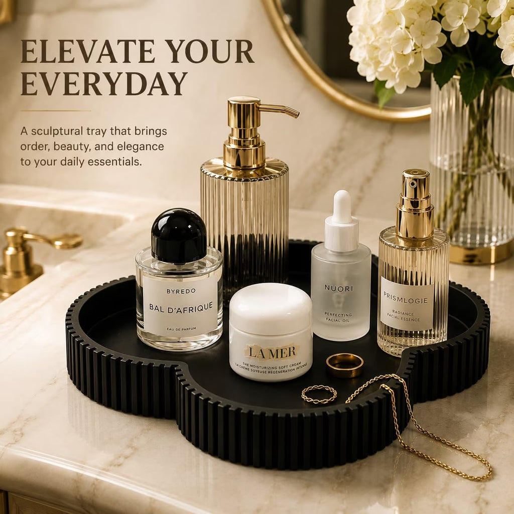 Black clover tray in bathroom holding perfume and skincare