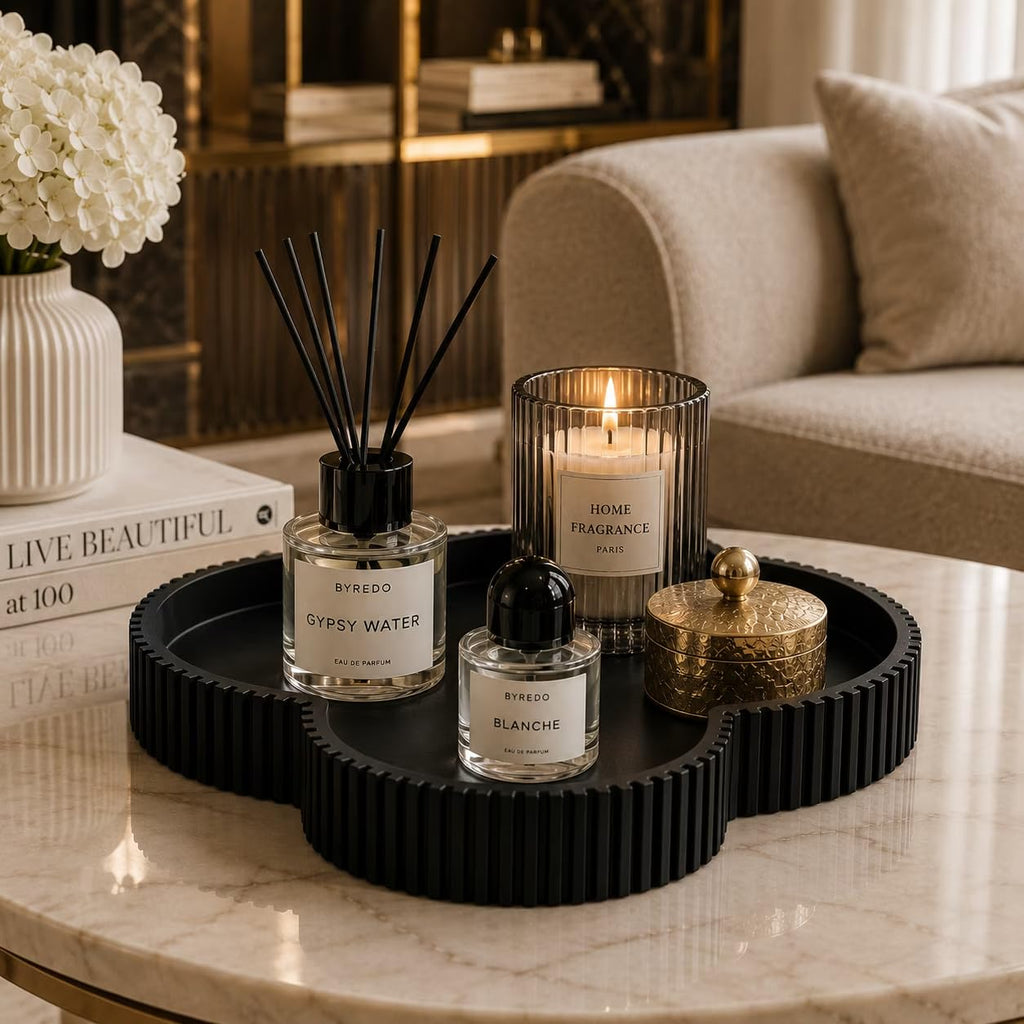 Black clover tray on coffee table with diffuser and candle