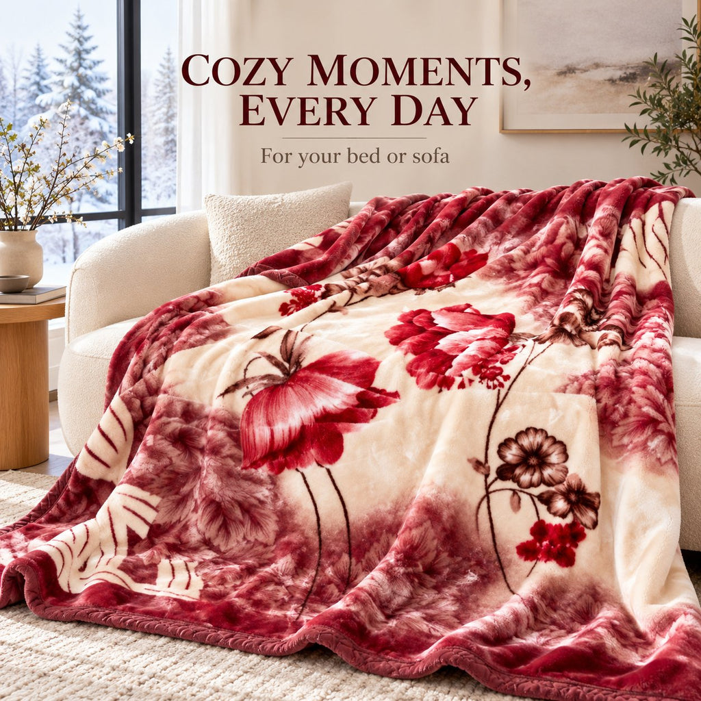 Red floral mink blanket draped over a sofa in a cozy living room
