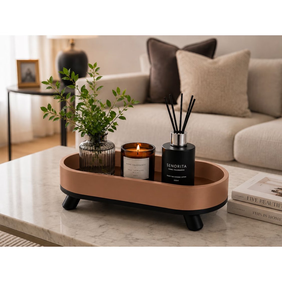 Down to earth oval tray on marble coffee table with diffuser