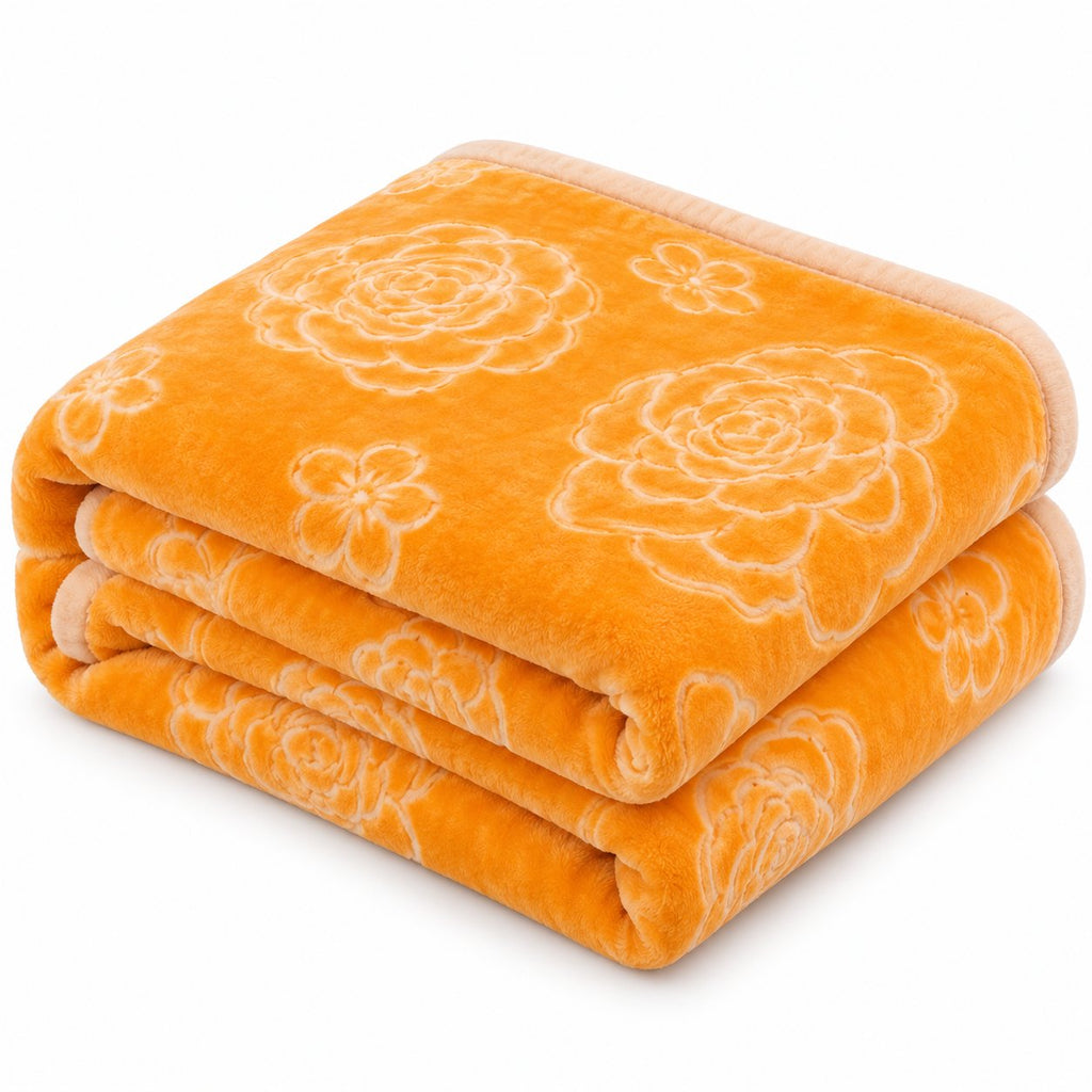 Gold embossed floral king blanket on bed, top view
