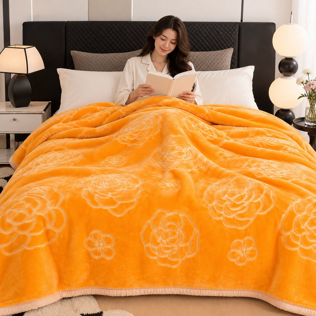 Gold embossed floral blanket draped on sofa