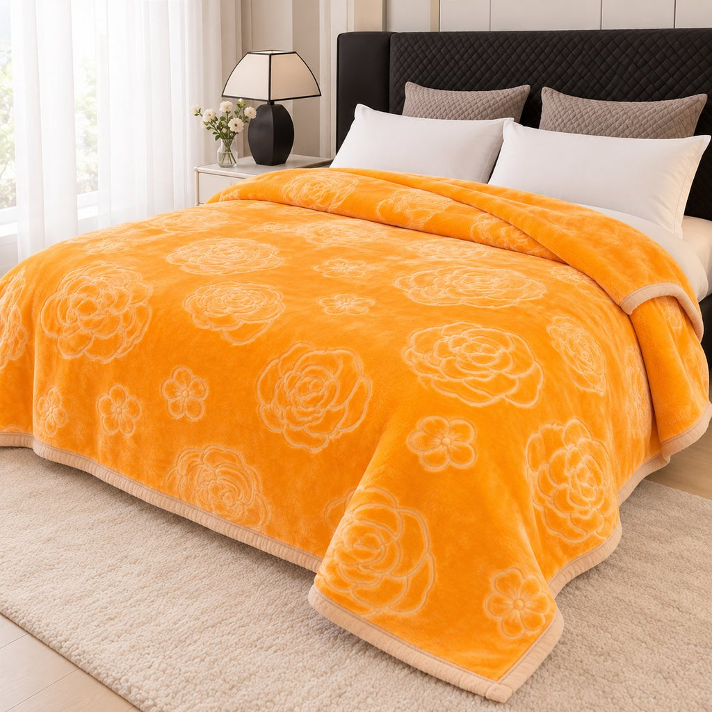 Gold embossed floral blanket on bed, bright bedroom