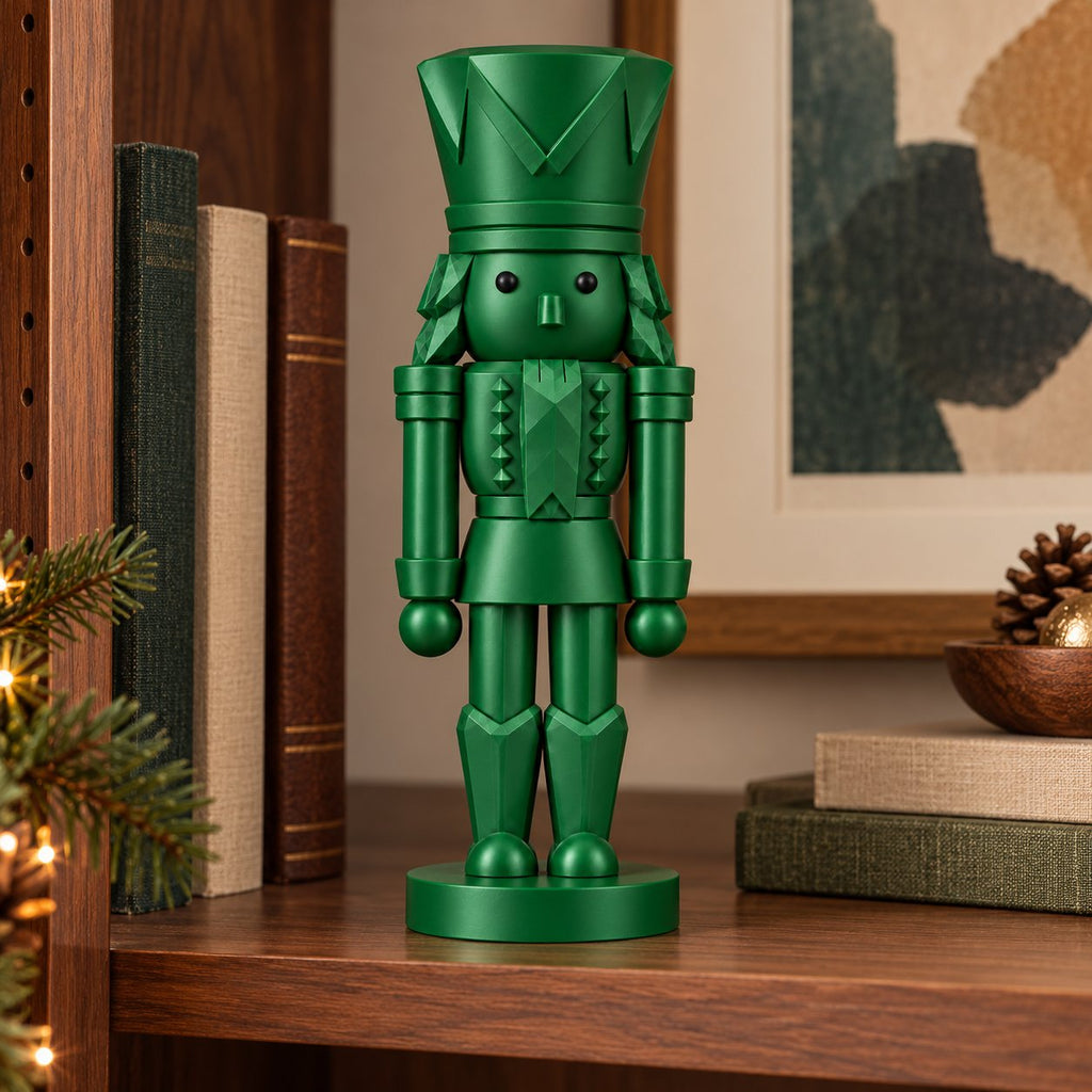 Emerald green nutcracker figurine on a bookshelf