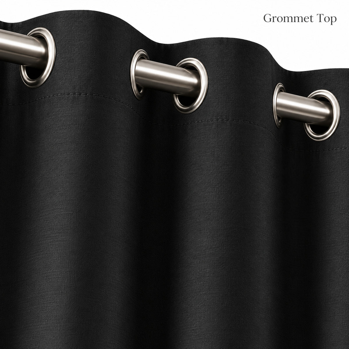 Close-up of silver grommets on black blackout curtain