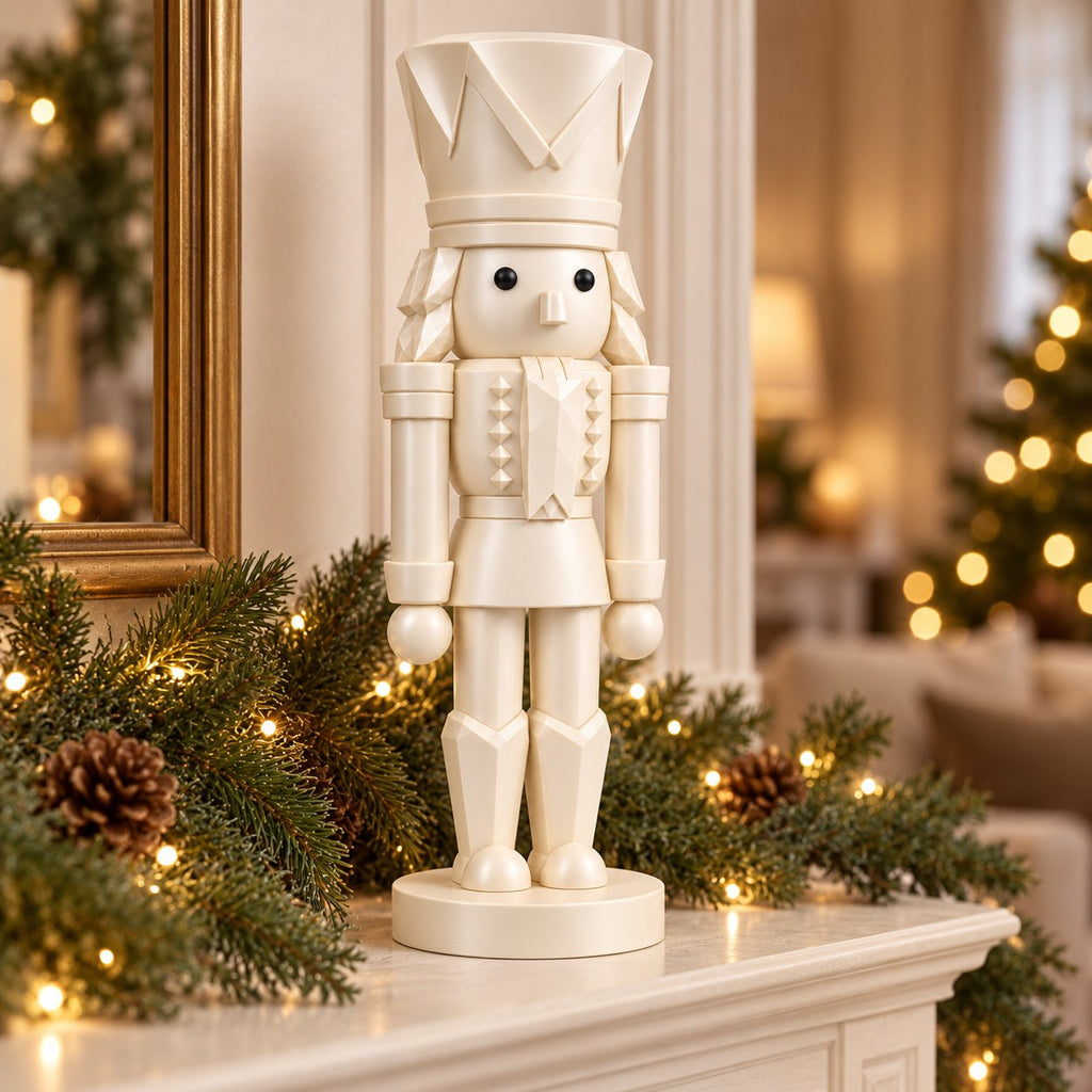 Ivory nutcracker figurine on a decorated mantel