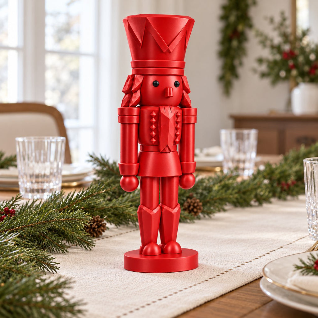 Classic red nutcracker figurine as a dining table centerpiece