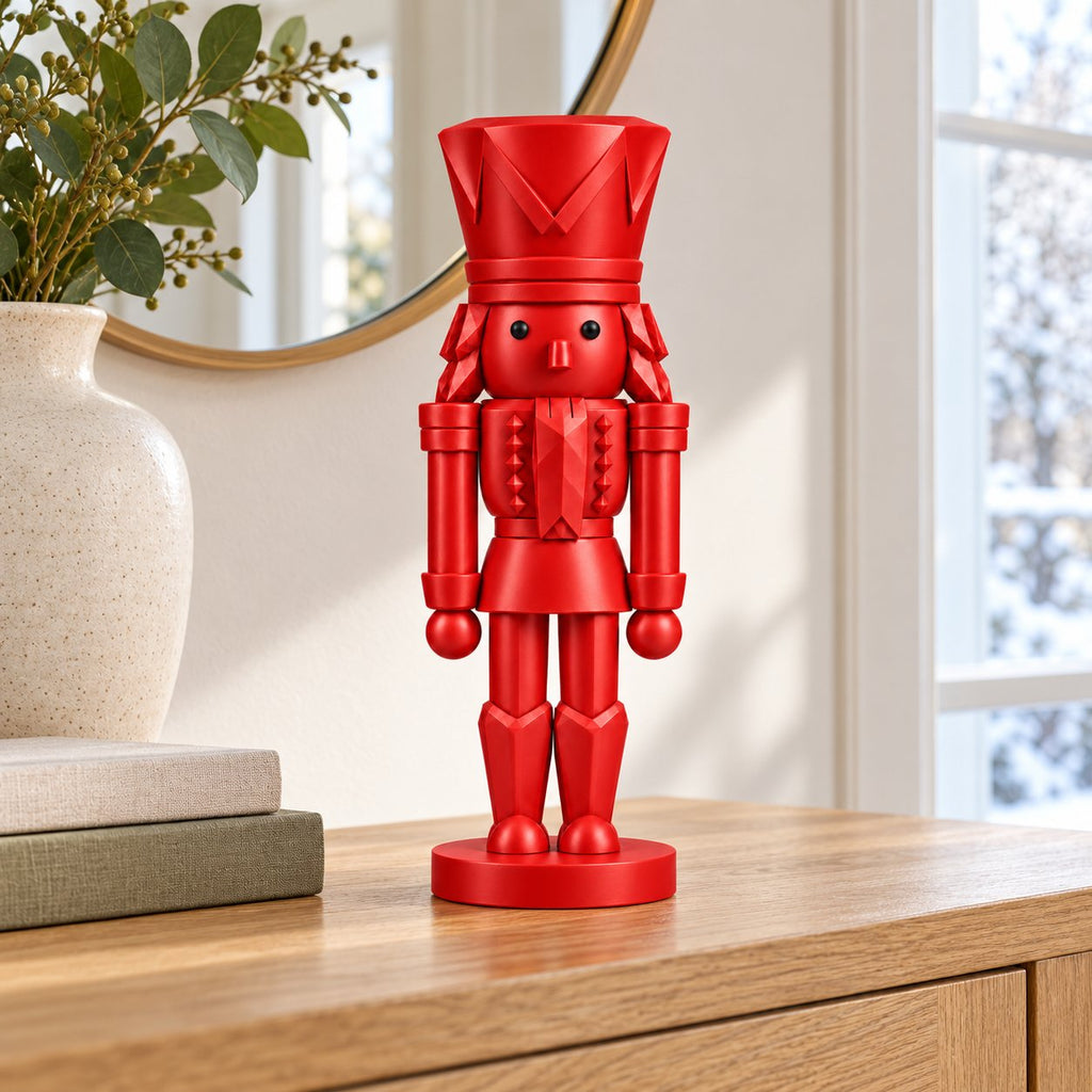 Classic red nutcracker figurine on an entryway console table