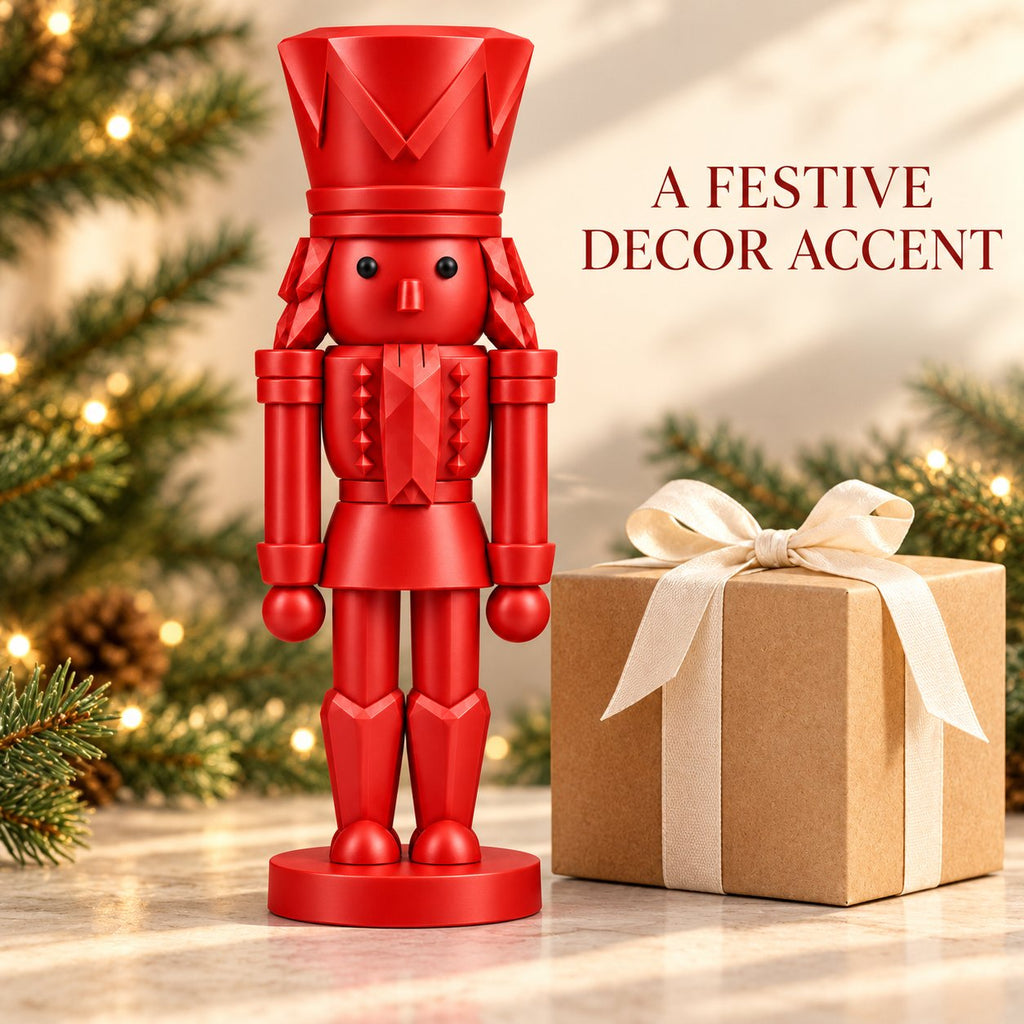 Classic red nutcracker figurine beside a wrapped gift box
