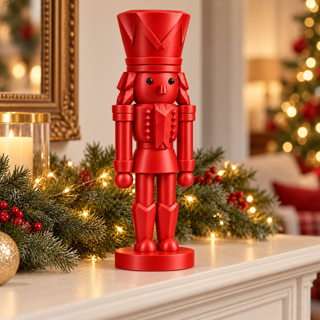 Classic red nutcracker figurine on a decorated mantel