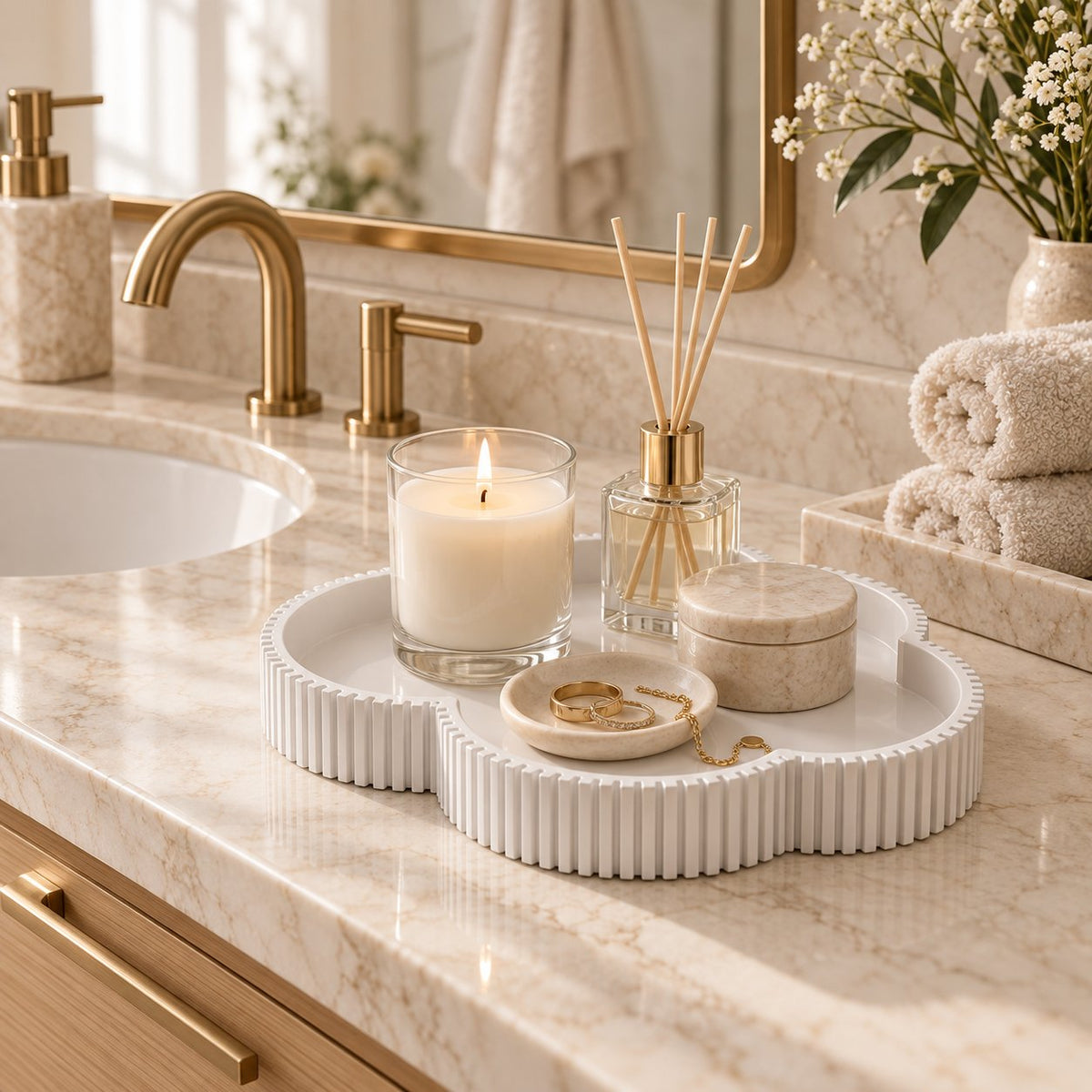 White clover tray on bathroom vanity with candle and jewelry