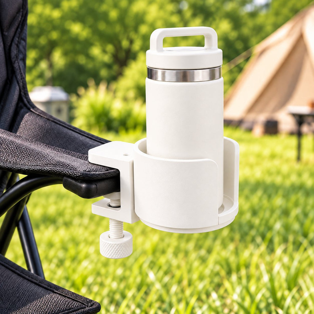 White cup holder clamped to camping chair armrest holding tumbler