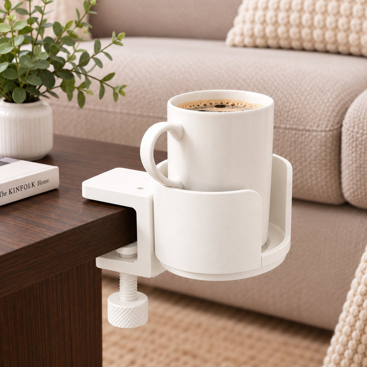 White clamp cup holder on coffee table holding coffee mug