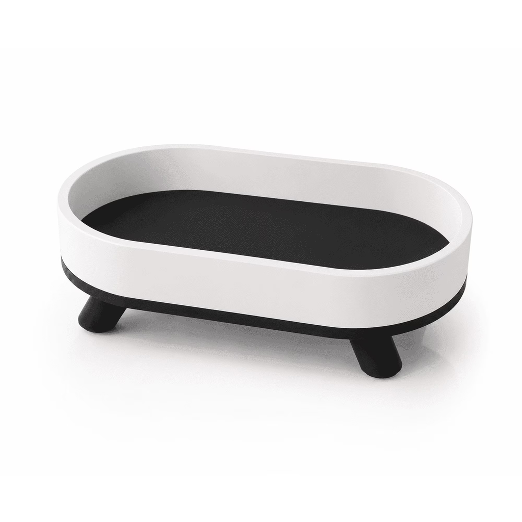 White and black oval decorative tray with feet, front view